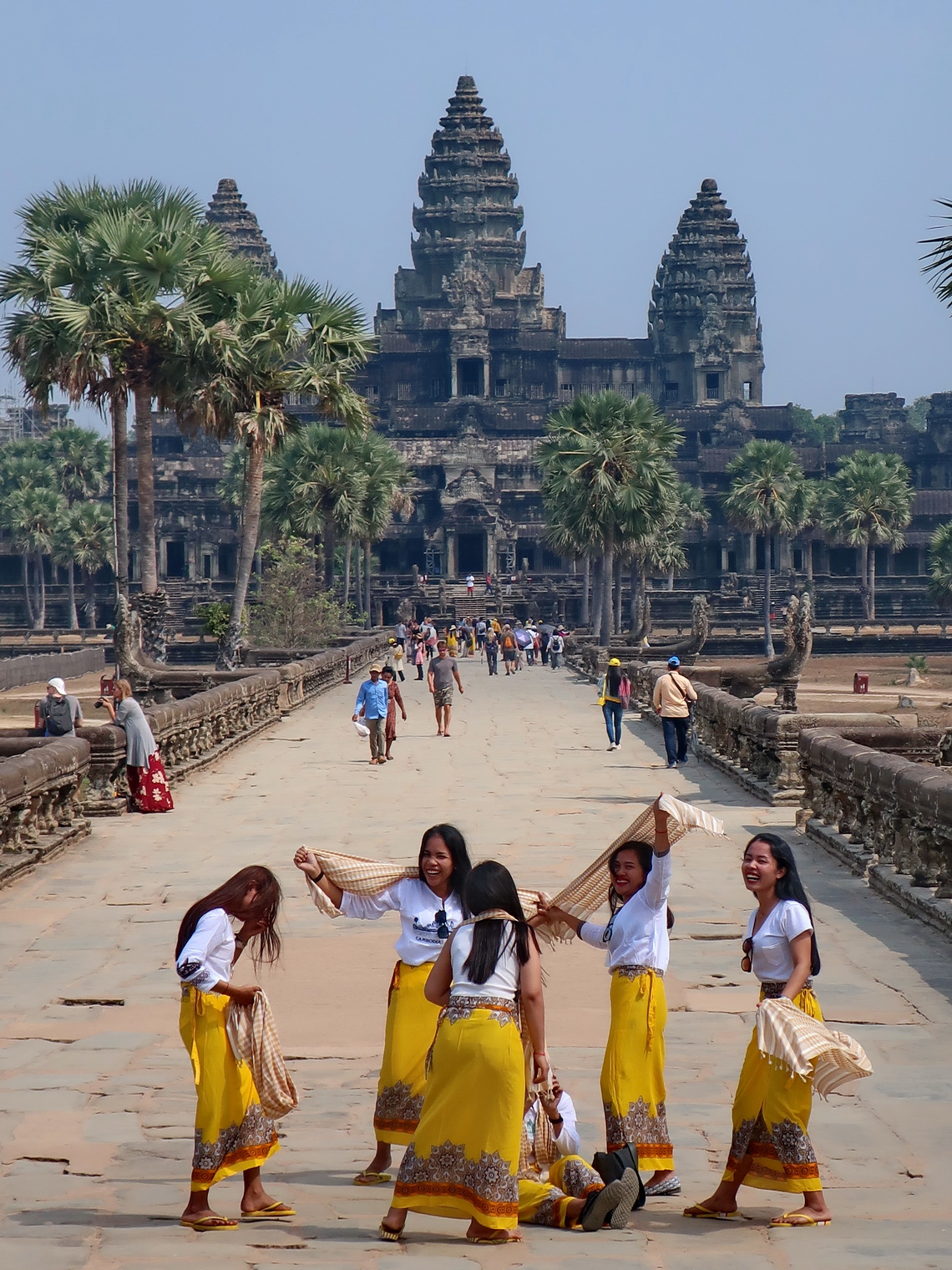 Cambodian girls with Angkor Wat