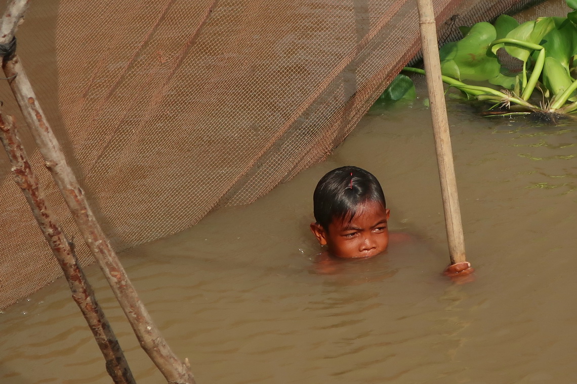 Boy enjoying the not so hot water