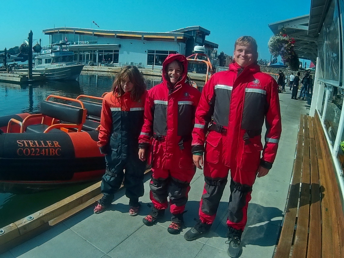 Three Astronauts in front of the litttle boat